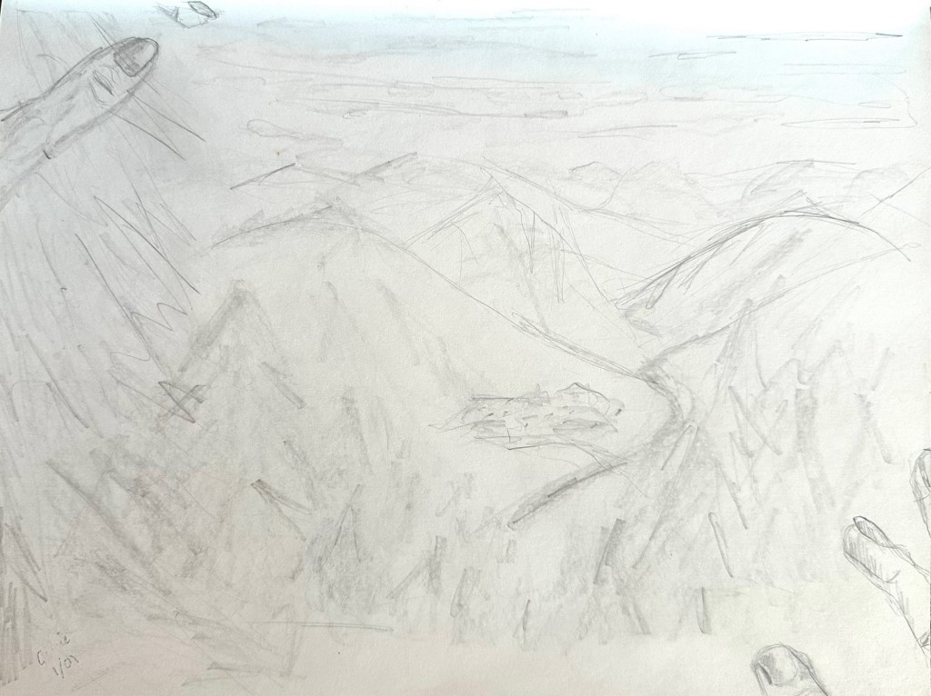 Very pale pencil sketch of a mountain and valley with possibly a pond; the artists finger tips frame the bottom right and top left corners.